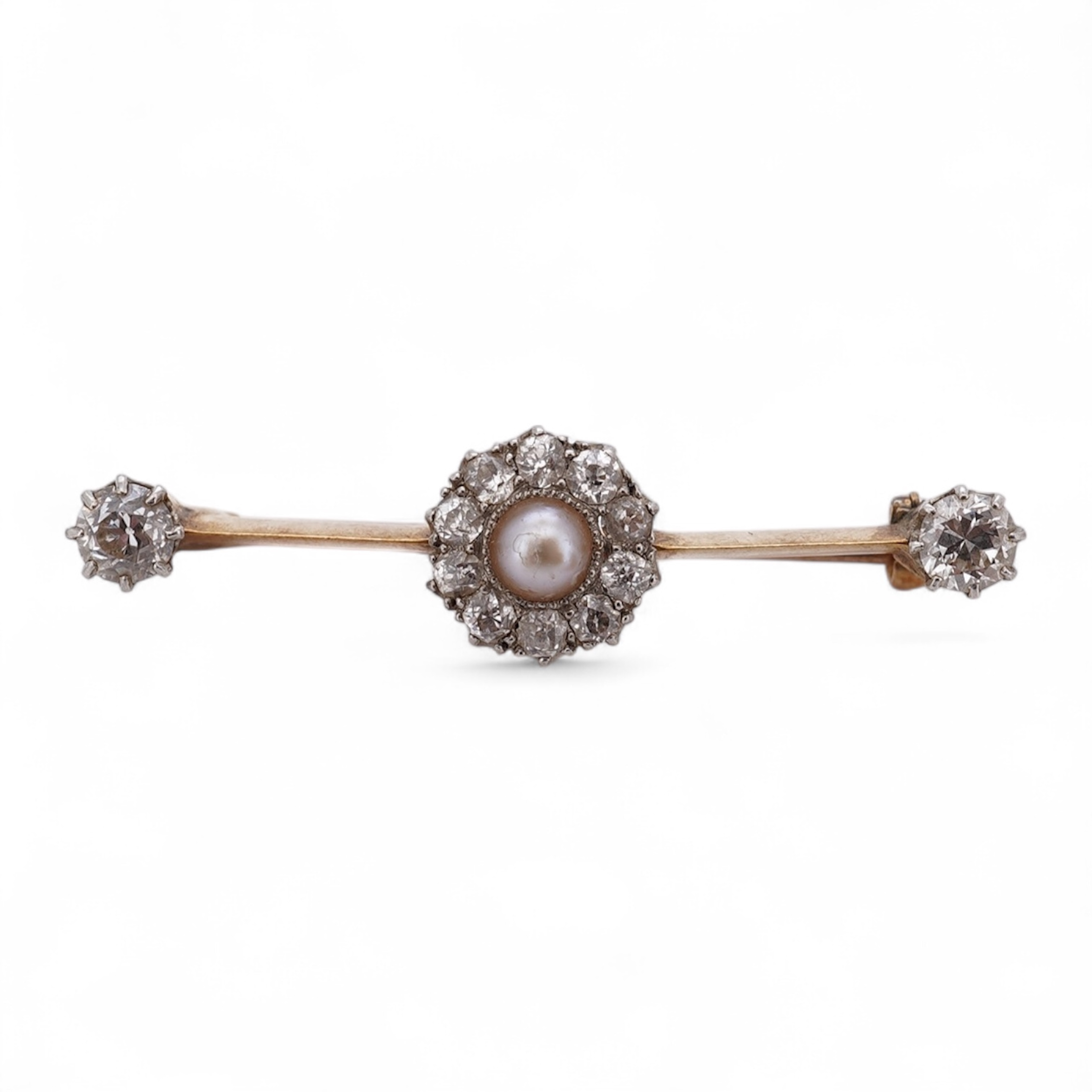 An early to mid 20th century yellow metal, split pearl and diamond cluster set bar brooch, 37mm, gross weight 4.3 grams. Condition - fair